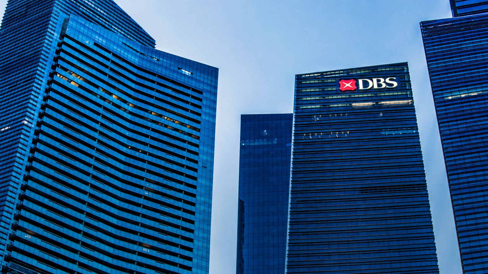 DBS sustains record first-quarter income on customer flows as rate compression bites